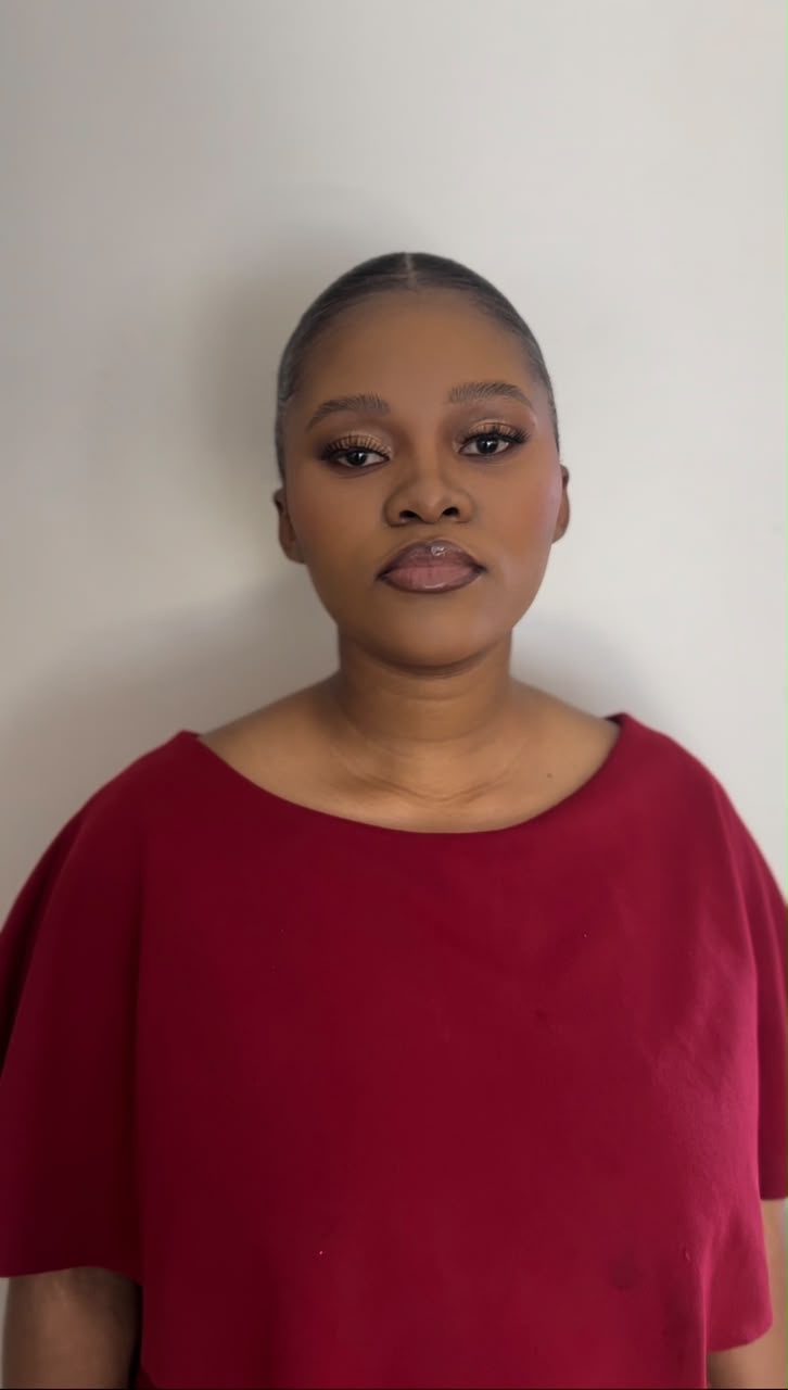 Client with polished event makeup, defined brows and lash extensions